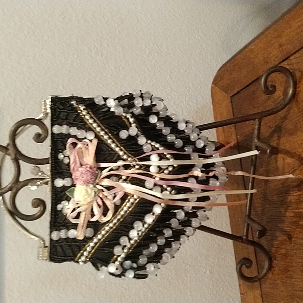 Feminine, black w/pink evening bag.